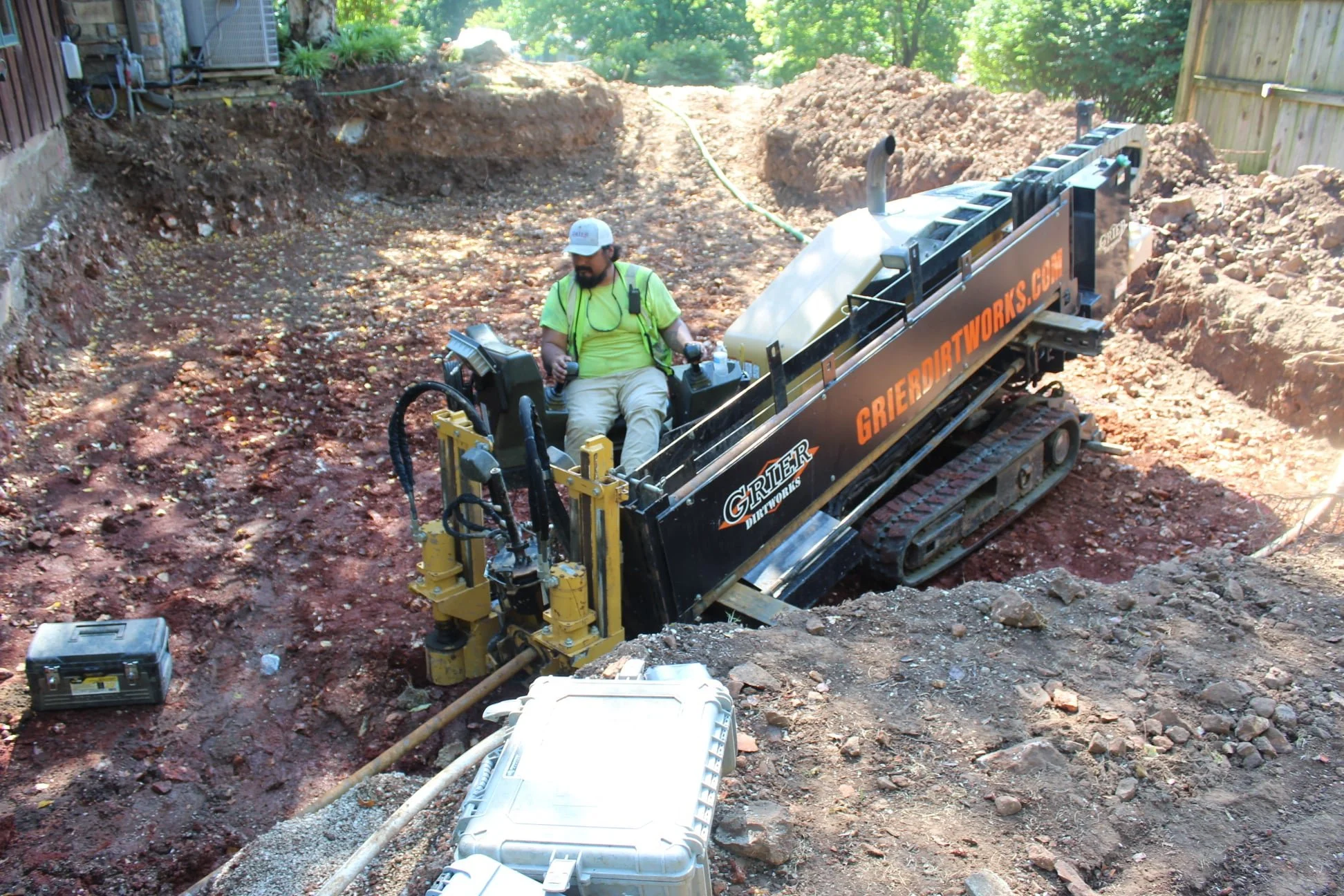 Operator running directional drill in backyard